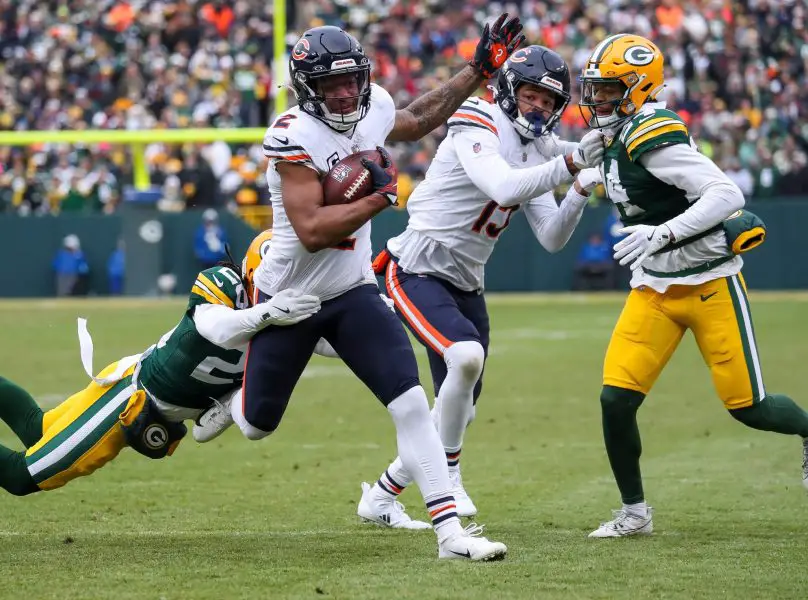 Chicago Bears wide receiver DJ Moore (2) is tackled by Green Bay Packers safety Xavier McKinney (29) to set up first and goal inside the five yard line on Sunday, January 5, 2025, at Lambeau Field in Green Bay, Wis. Tork Mason/USA TODAY NETWORK-Wisconsin